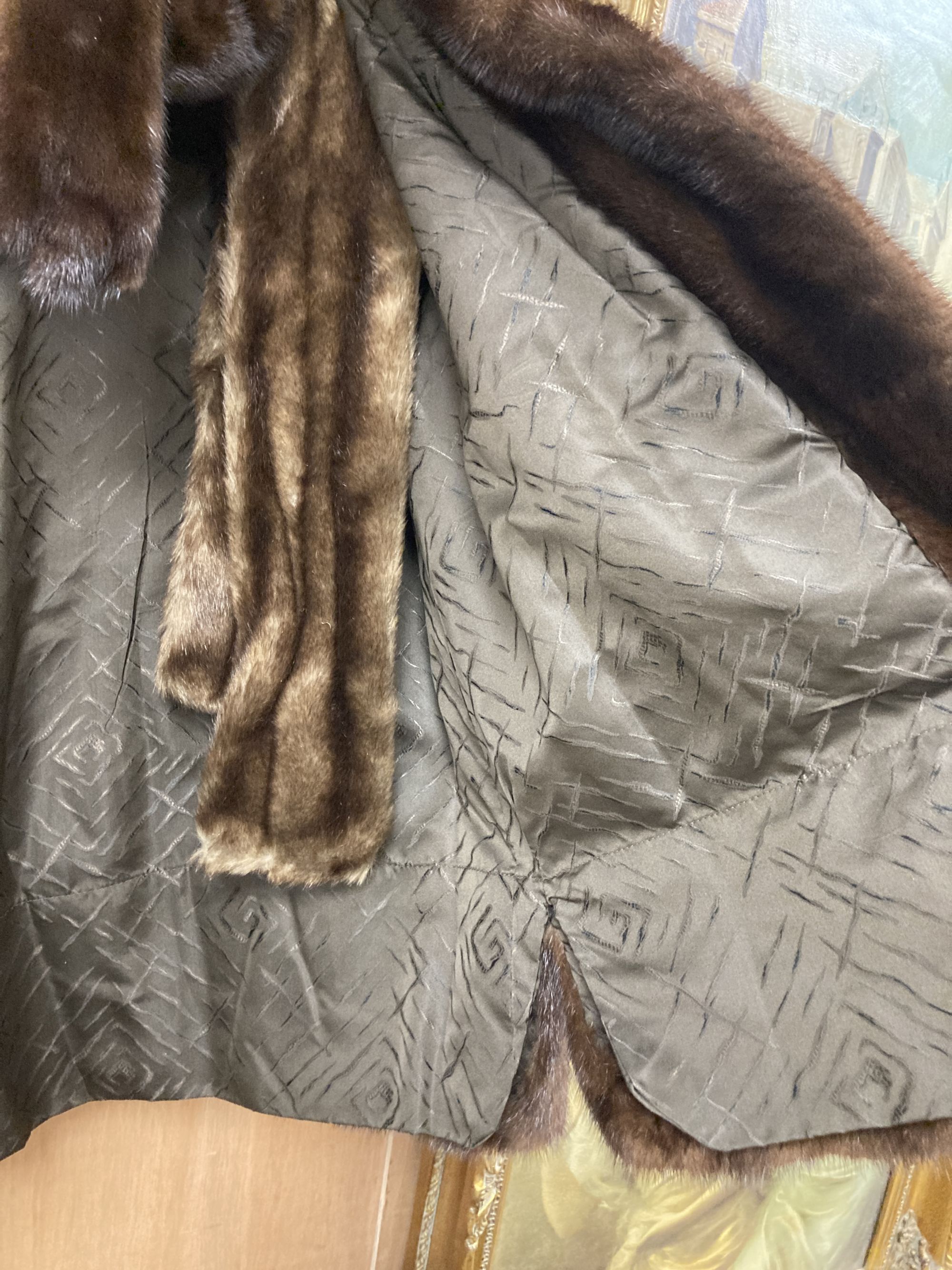 A brown mink fur coat, hat and ties